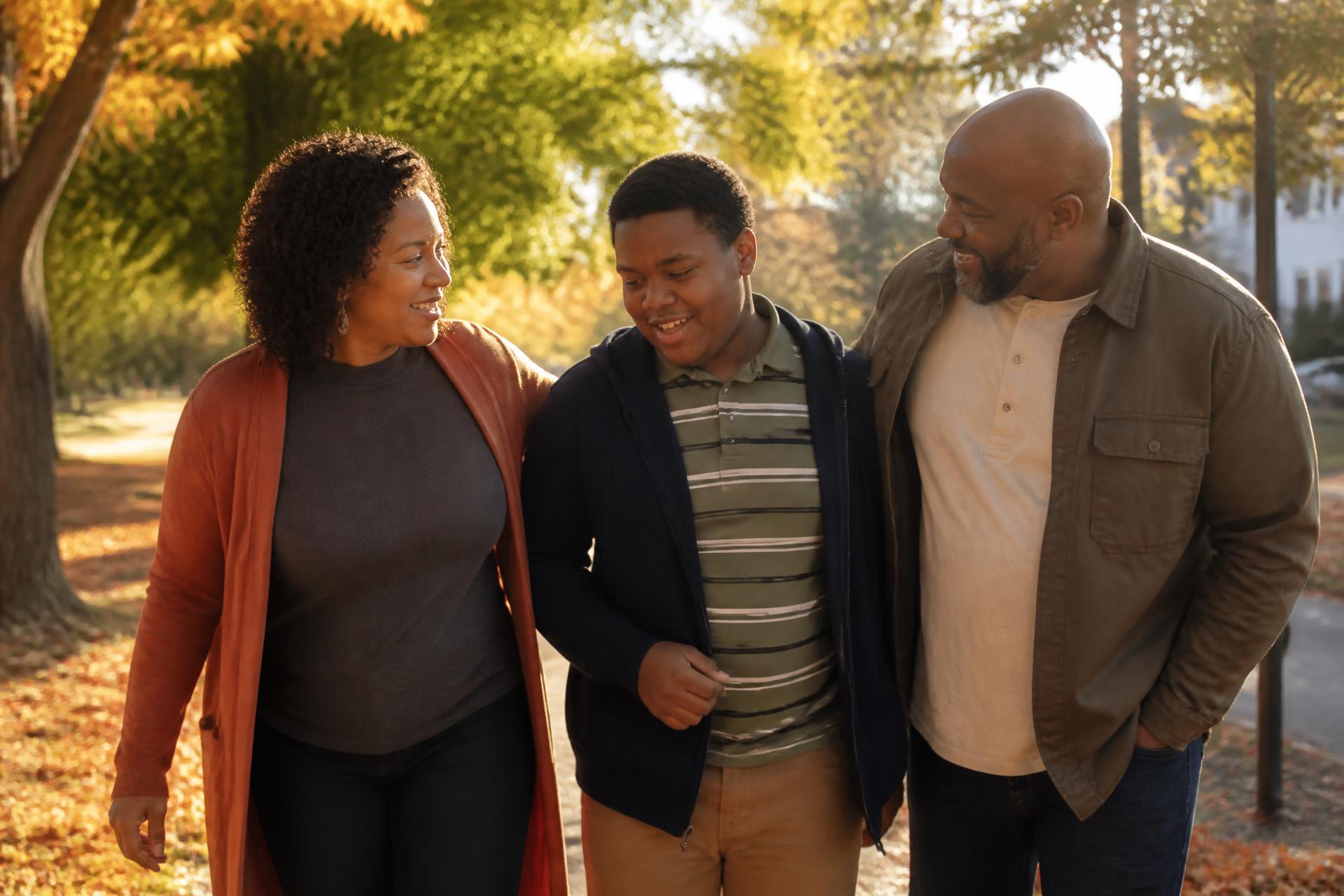 A family walking together in warm afternoon light